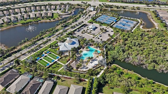 drone / aerial view featuring a water view and a residential view