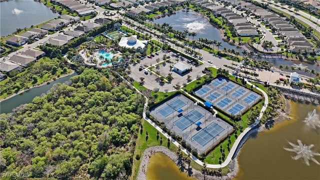 birds eye view of property with a water view and a residential view