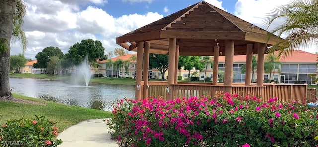 surrounding community featuring a gazebo and a water view