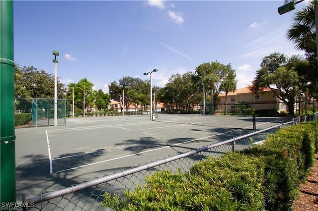 view of sport court with fence