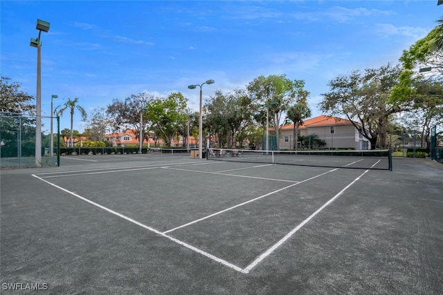 view of tennis court with fence