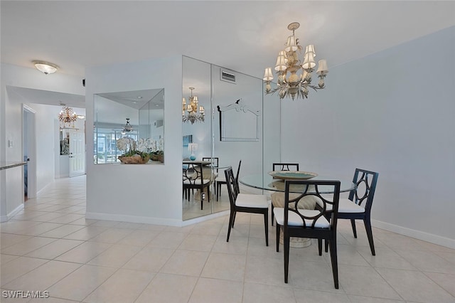 dining area featuring light tile patterned floors, visible vents, baseboards, and an inviting chandelier