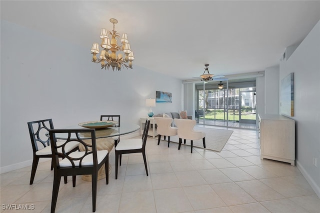 dining space with light tile patterned floors, ceiling fan with notable chandelier, and baseboards