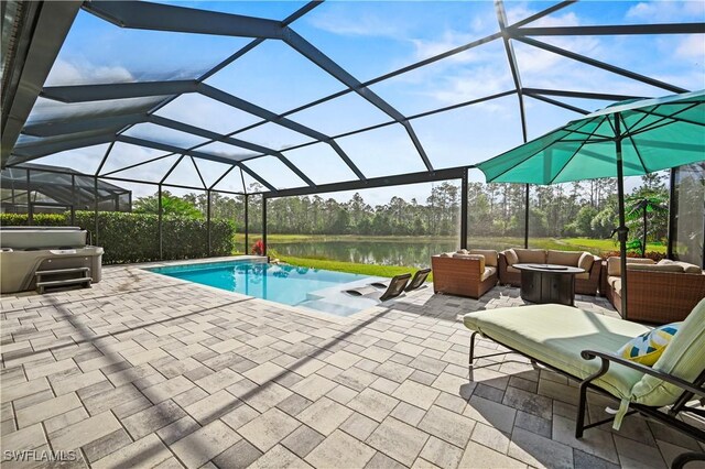 pool featuring a patio area, a lanai, a water view, and an outdoor hangout area