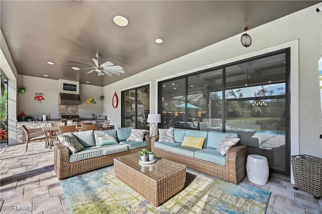 view of patio / terrace with an outdoor hangout area, ceiling fan, outdoor dining space, and an outdoor kitchen