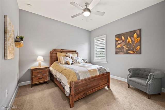 bedroom with baseboards, vaulted ceiling, a ceiling fan, and light colored carpet