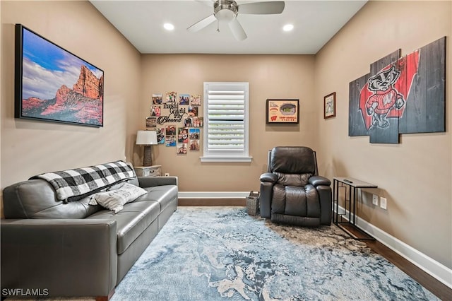 interior space featuring a ceiling fan, baseboards, wood finished floors, and recessed lighting