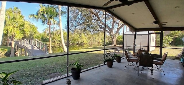 sunroom with ceiling fan and a healthy amount of sunlight