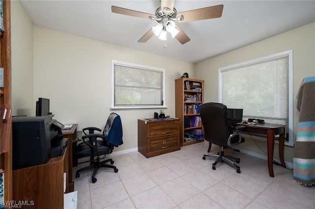 office with light tile patterned floors, ceiling fan, and baseboards