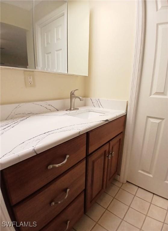 bathroom featuring tile patterned flooring and vanity