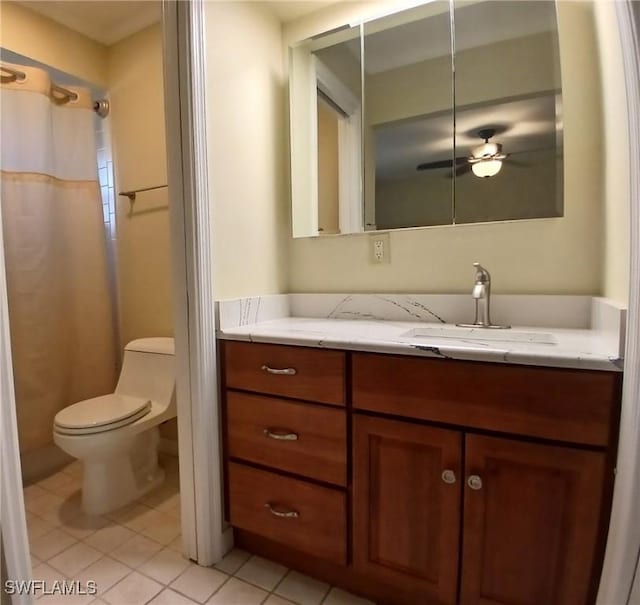 full bath featuring curtained shower, vanity, toilet, and tile patterned floors