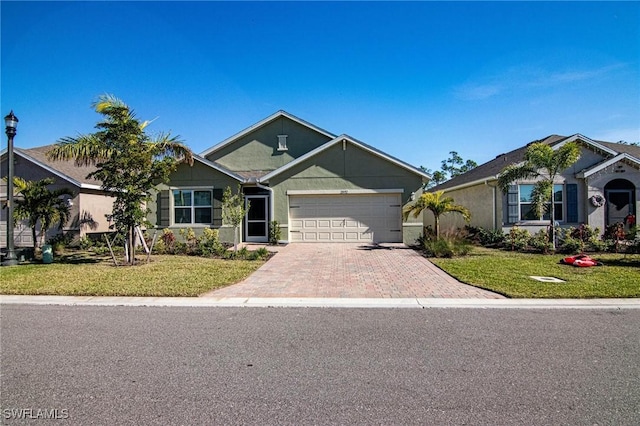 view of front of property featuring decorative driveway, an attached garage, and a front lawn