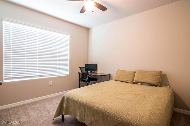 bedroom featuring carpet flooring, a ceiling fan, and baseboards