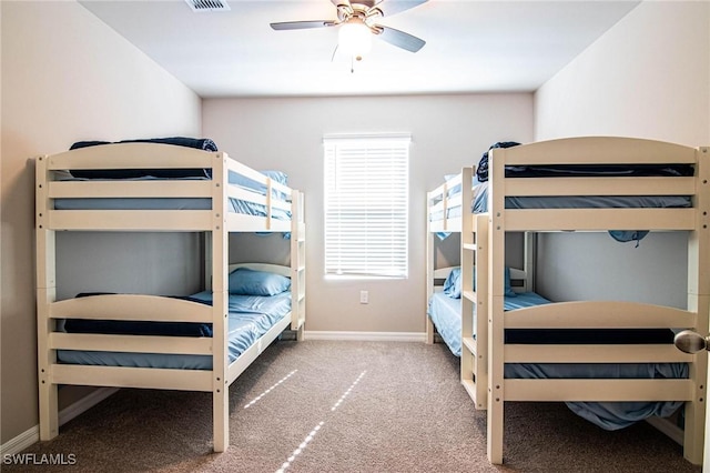 bedroom with ceiling fan, carpet floors, visible vents, and baseboards