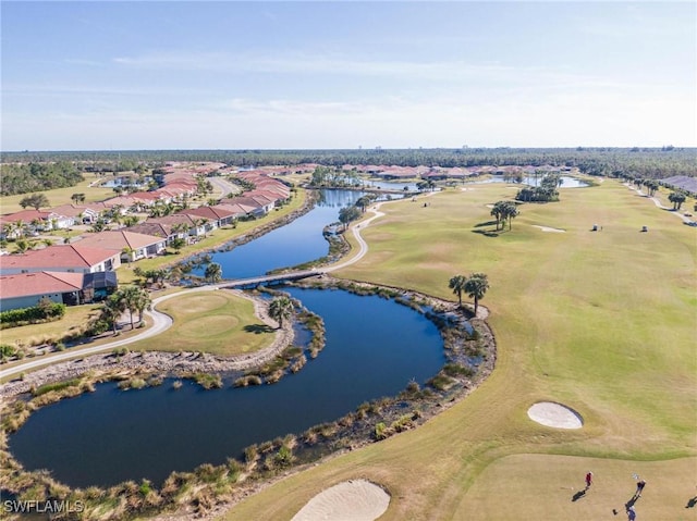 drone / aerial view featuring a residential view, a water view, and golf course view