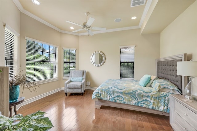 bedroom with recessed lighting, visible vents, baseboards, light wood-style floors, and crown molding