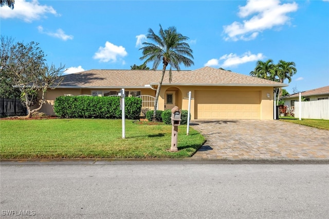 ranch-style house with a garage, a front lawn, and stucco siding