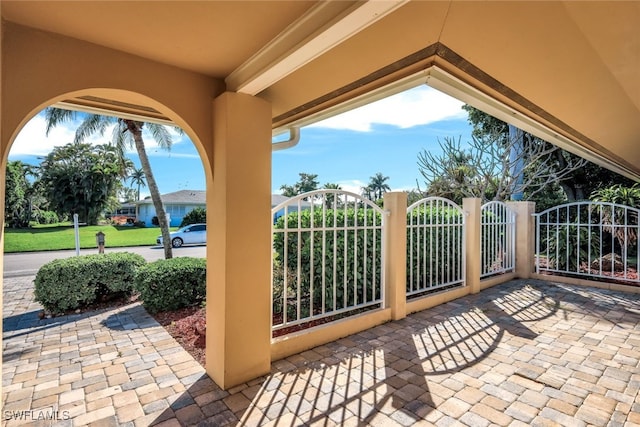 view of patio featuring a gate