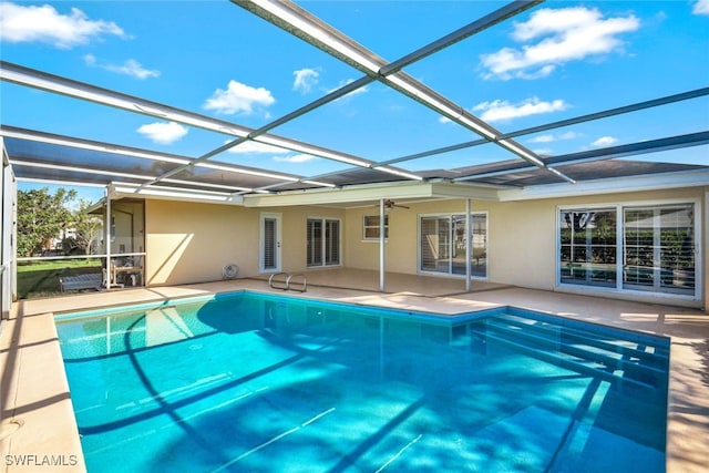 pool with a lanai and a patio