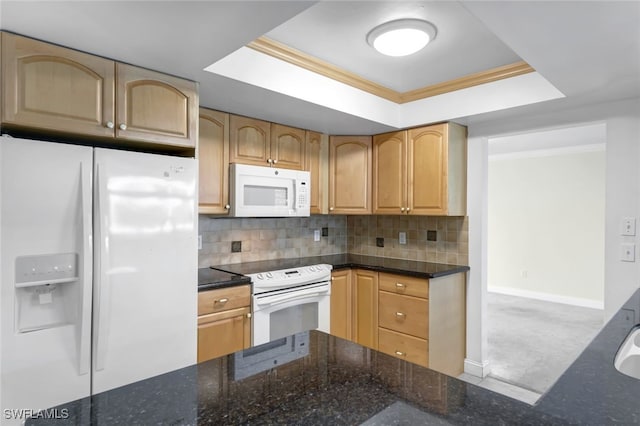 kitchen with white appliances, tasteful backsplash, and dark stone countertops