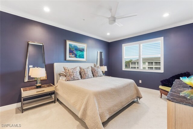 bedroom featuring a ceiling fan, light colored carpet, crown molding, and baseboards