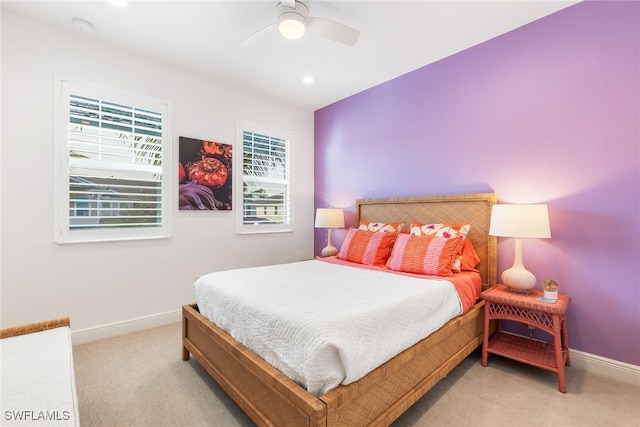 bedroom featuring baseboards, recessed lighting, a ceiling fan, and light colored carpet