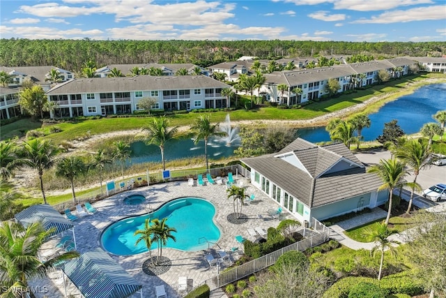 bird's eye view featuring a residential view and a water view