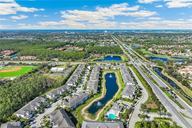 bird's eye view featuring a water view and a residential view