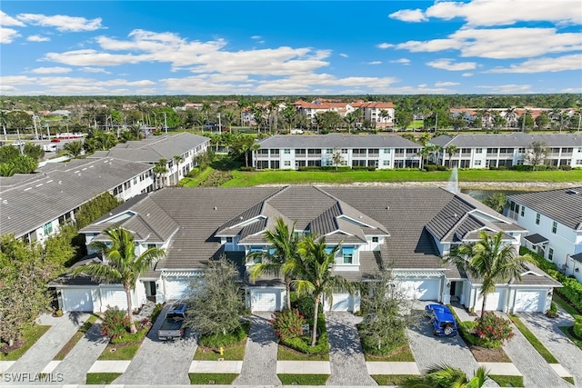 birds eye view of property with a residential view