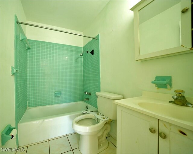 bathroom with tub / shower combination, vanity, toilet, and tile patterned floors