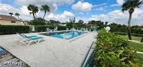 community pool with a patio