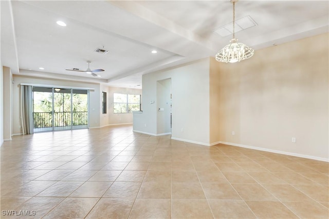 spare room with light tile patterned flooring, visible vents, baseboards, and ceiling fan with notable chandelier