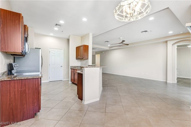 kitchen with recessed lighting, visible vents, a ceiling fan, open floor plan, and range