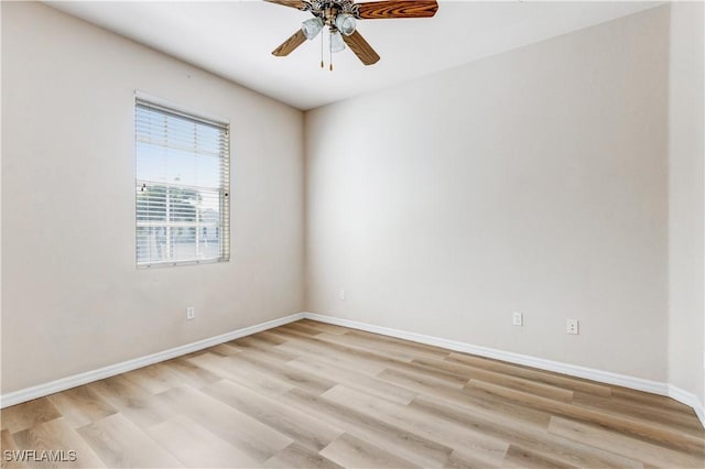 unfurnished room with a ceiling fan, light wood-type flooring, and baseboards