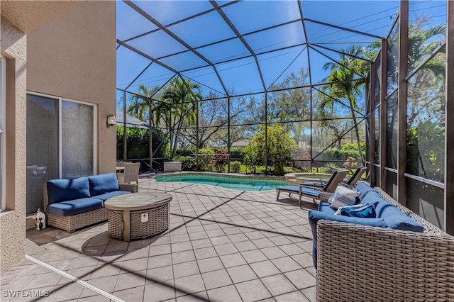 view of patio / terrace featuring glass enclosure and an outdoor pool