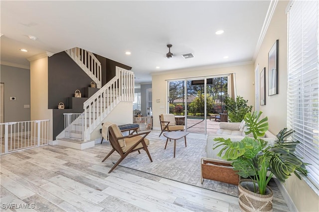 sitting room featuring recessed lighting, crown molding, and wood finished floors