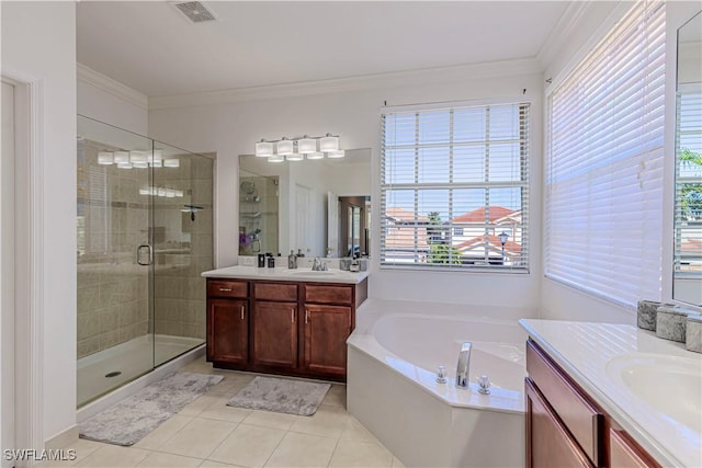 bathroom featuring a sink, visible vents, a healthy amount of sunlight, a stall shower, and crown molding