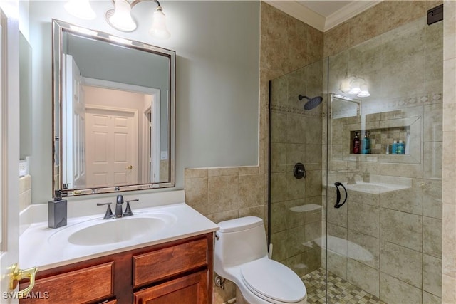 full bathroom with tile walls, toilet, ornamental molding, a shower stall, and vanity