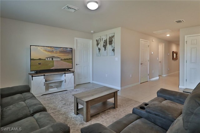 living room with light tile patterned floors, baseboards, and visible vents