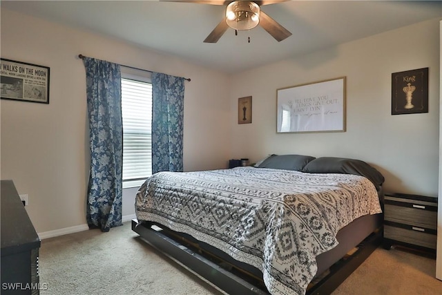 carpeted bedroom featuring ceiling fan and baseboards