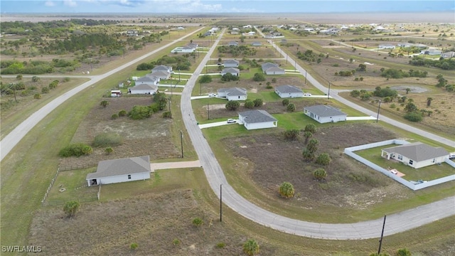 birds eye view of property with a residential view