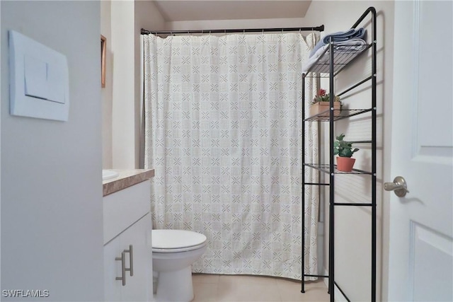 full bathroom featuring vanity, toilet, and tile patterned floors