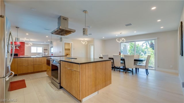 kitchen featuring appliances with stainless steel finishes, recessed lighting, island range hood, and modern cabinets