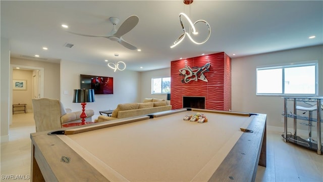 playroom with a large fireplace, recessed lighting, visible vents, and pool table