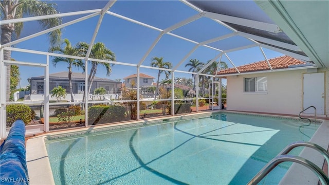 pool featuring a lanai and a patio