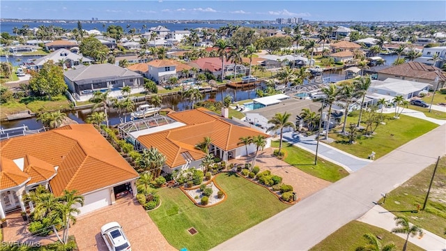 bird's eye view featuring a water view and a residential view