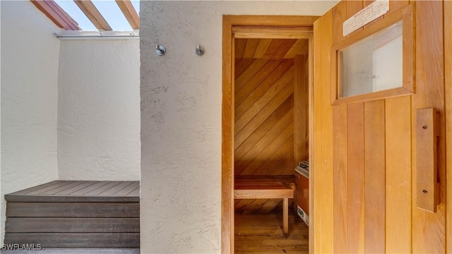 view of sauna / steam room with a textured wall