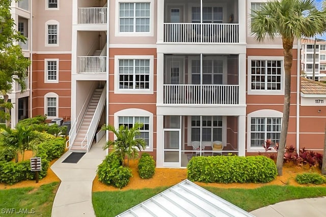 view of property with stairway