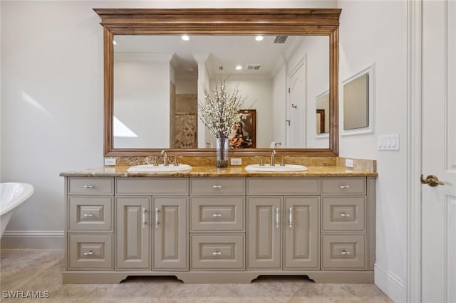 bathroom featuring double vanity, a sink, and visible vents