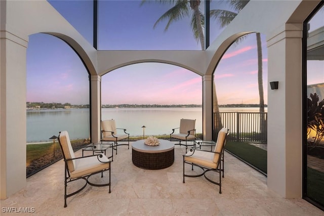 patio terrace at dusk with a water view